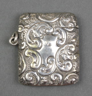 An Edwardian repousse silver vesta with rubbed marks