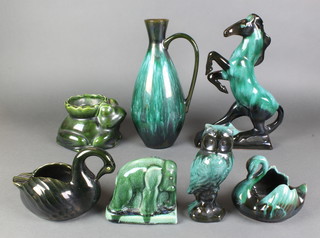 A collection of turquoise glazed Canadian Mountain pottery figures of animals and vases