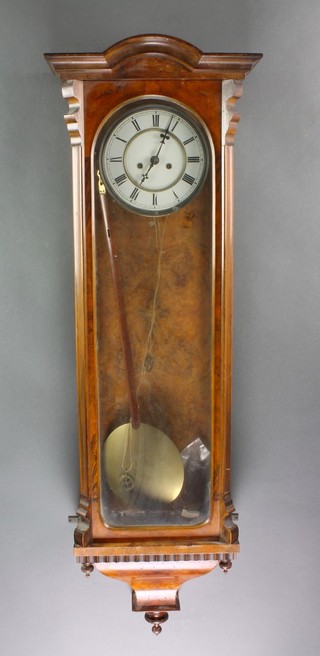 A Victorian Vienna style striking regulator with 6 1/2" enamelled dial and Roman numerals contained in a figured walnut case 