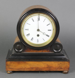 A Victorian French 8 day timepiece having a 5" enamelled dial with Roman numerals contained in a walnut and ebonised case 