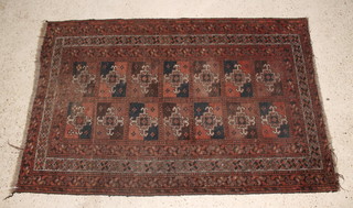 A red ground Afghan rug with stylised hook gulls to the centre within multi row border 56" x 36"