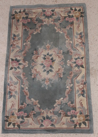 A blue ground and floral pattern Chinese rug 63 1/2" x 36 1/2" 