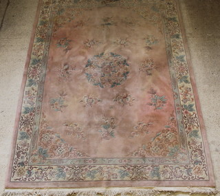 A pink and floral patterned Chinese carpet 147" x 108" 