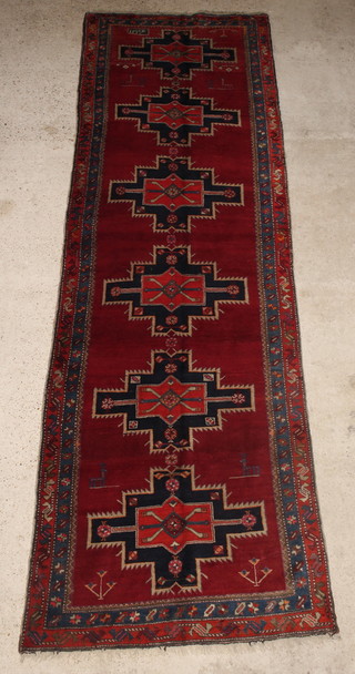 A Persian Tafresh blue and white runner with 6 stylised octagons to the centre 155" x 49"  