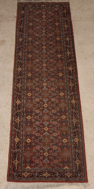 An Indo Persian pink ground and floral patterned runner 139" x 39" 