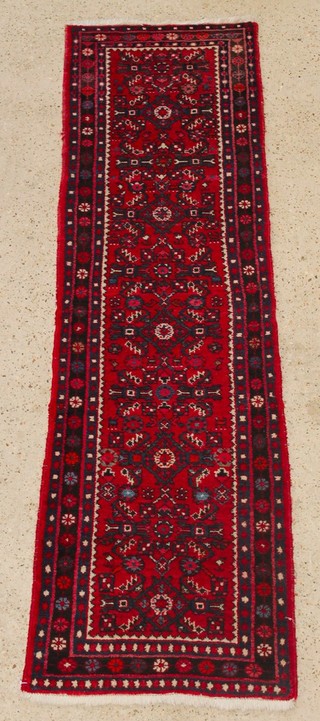 A Persian red and blue ground Mehraban runner 80" x 25" 