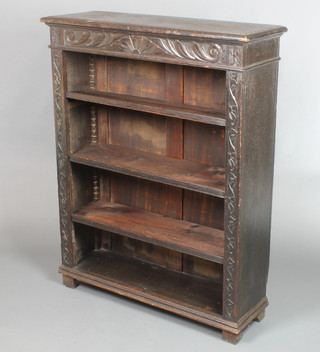 A Victorian carved oak bookcase fitted adjustable shelves, raised on bracket feet 45"h x 36"w x 11 1/2"d 