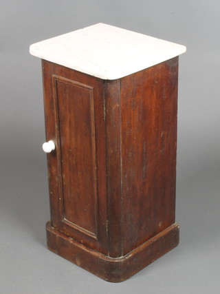 A Victorian mahogany pot cupboard with white veined marble top and panelled door, raised on a platform base 29"h x 14 1/2"w x 13 1/2"d 