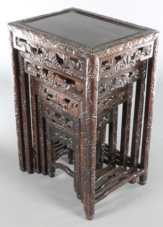 A nest of 5 Chinese carved and pierced hardwood interfitting coffee tables - largest 27"h x 18"w x 14"d, 23"h x 15 1/2"w x 12"d, 19"h x 13"w x 10"d, 15"h x 10"d x 8 1/2"d and smallest 11"h x 8"w x 7"d  