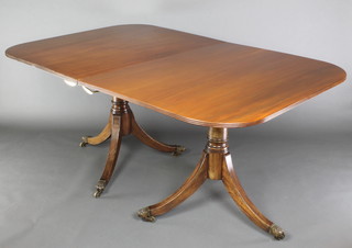 A Georgian style mahogany twin pillar D end extending dining table with 1 extra leaf, 29 1/2"h x 42"w x 64"l x 87 1/2"l with extra leaf 
