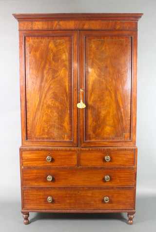 A Georgian inlaid mahogany linen press, the upper section with moulded cornice and panelled doors, the base fitted 2 long drawers above 2 short drawers, raised on turned supports 87"h x 50"w x 24"d
