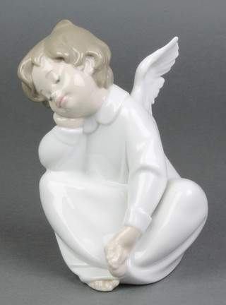 A Lladro figure of a seated angel 4961 6" 