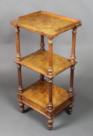 A Victorian figured walnut 4 tier what-not with three-quarter gallery, raised on turned and fluted columns, the base fitted a drawer 36"h x 17"w x 14"d 