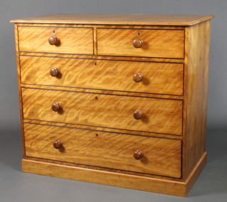 A Victorian satin birch chest of 2 short and 3 long drawers with tore handles and brass escutcheons, raised on a platform base 38"h x 44"w x 23"d 