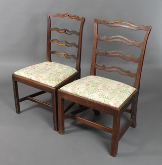 2 similar 19th Century mahogany London ladder back dining chairs with upholstered drop in seats, raised on square supports with H framed stretcher 