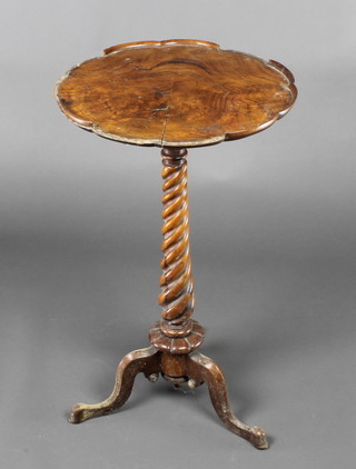 A Victorian circular figured walnut wine table raised on a spiral turned column and tripod base 29"h x 17" diam. 