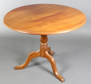A Victorian mahogany snap top tea table, raised on a turned column and tripod base 27"h x 34" diam. 