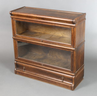 An oak 2  tier Globe Wernicke bookcase, the base fitted a drawer 34"h x 34"w x 12"d 
