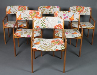 A set of 6 1960's teak carver chairs, upholstered in floral patterned material 