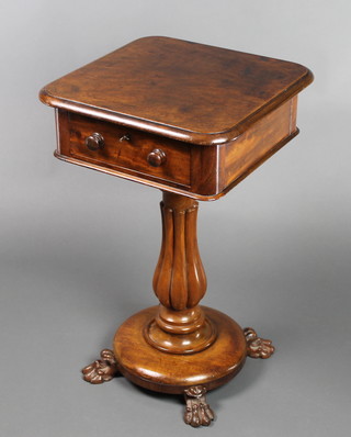 A Victorian mahogany work table fitted a drawer and raised on a turned fluted column with circular base and paw feet 28 1/2"h x 18"w x 17 1/2"d 