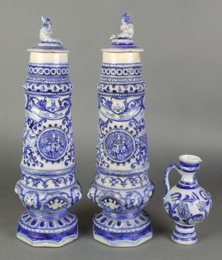 A pair of German stoneware 2 coloured vases with lion masks and figural covers 14", a similar bottle 7" 