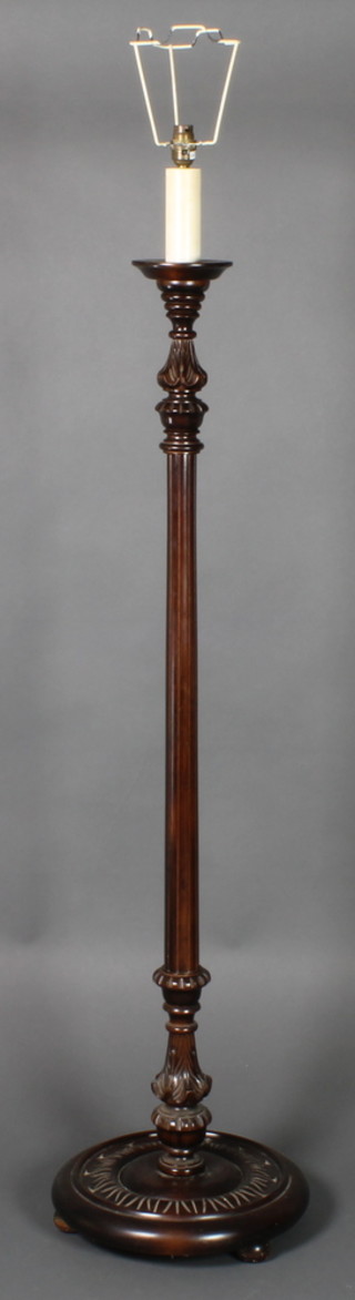 A turned and fluted mahogany standard lamp 