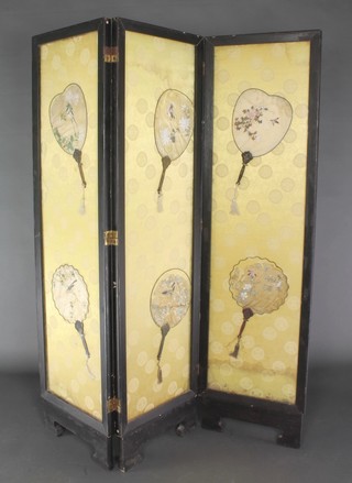 An ebonised 3 fold dressing screen with yellow silk panels decorated 6 fans, painted birds 66"h x 54 1/2"l 