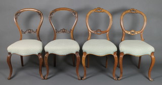 2 pairs of Victorian mahogany carved balloon back dining chairs with upholstered serpentine fronted seats, raised on cabriole supports 