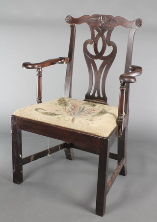 A Georgian mahogany Chippendale style carver chair with slat back and upholstered seat, raised on square supports with box frame stretcher 