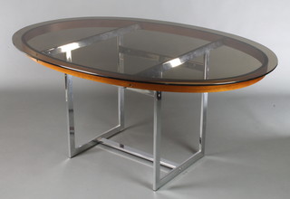 Richard Young by Merrow Associates, a 1960's/70's Danish polished chrome and teak oval dining table with smoked plate glass top 28"h x 62 1/2"l x 44"w 