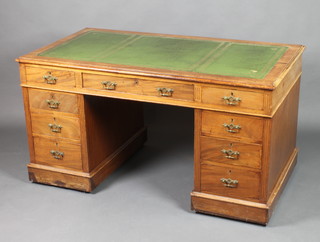 A Victorian mahogany kneehole desk with inset green leather writing surface above 1 long and 8 short drawers 28"h x 54"w x 29"d 