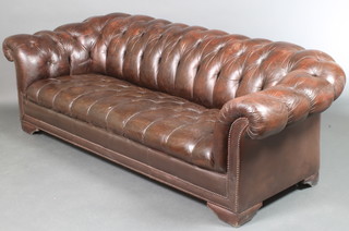A 3 seat Chesterfield sofa upholstered in buttoned back brown leather 25"h x 80"w x 37"d 
