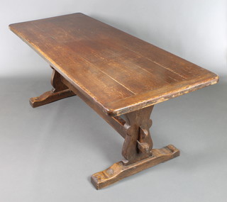 An oak refectory table with 4 plank top, raised on standard end supports with H framed stretcher 29"h x 75 1/2"l x 30"w 