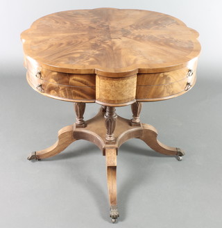 A Georgian style circular drum table with segmented veneered top, fitted 1 long and 4 short drawers, raised on turned column with triform base and splayed feet 28"h x 31"diam. 