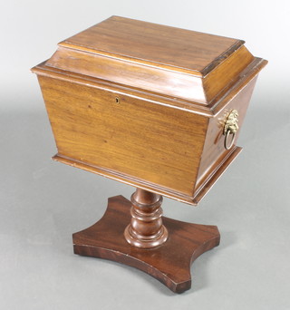A Victorian mahogany rectangular cellarette/work box of sarcophagus form with hinged lid, the interior fitted divisions with brass lion mask handles, raised on turned column and triform base 27"h x 20 1/2"w x 15"d  