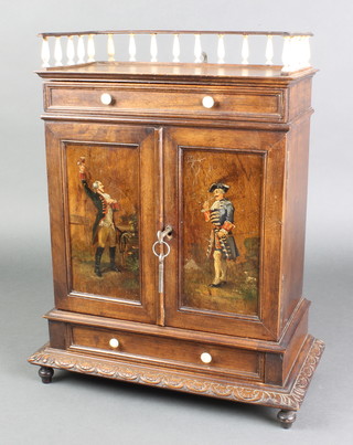 A Lalu, a Continental cedar table top cigar cabinet with 3/4 gallery with turned ivory balustrade fitted a drawer, the interior fitted 9 trays and enclosed by a panelled door, decorated standing gentleman, the base fitted a drawer with turned ivory handles, raised on bun feet 17"h x 14"w x 7"d 