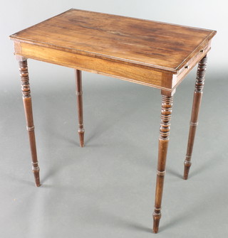 A rectangular Regency mahogany occasional table fitted brushing slides and raised on ring turned supports 29"h x 26"w x 17"w 
