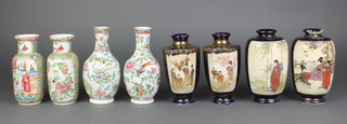 A pair of hexagonal early 20th Century Satsuma blue ground vases decorated with panels of figures 6", a pair of bulbous ditto 6", a pair of famille rose oviform vases with birds amongst flowers 6 1/2" and a pair of Cantonese cylindrical vases with waisted necks decorated with panels of figures in pavilions 6" 