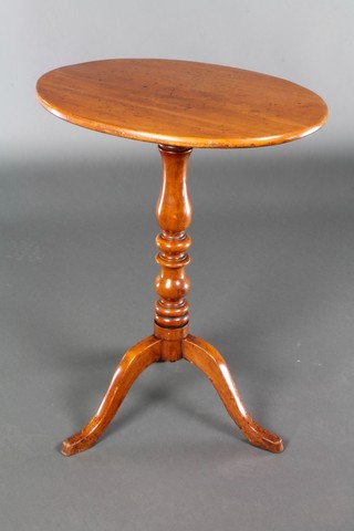 A Victorian oval mahogany snap top wine table, raised on pillar and tripod supports 28"h x 21 1/2"w x 16 1/2"d 
