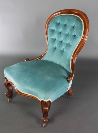A Victorian mahogany show frame tub back chair upholstered in blue buttoned material, the base of serpentine outline raised on cabriole supports 