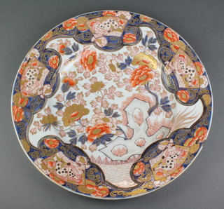 A good 19th Century Imari plate decorated with flowers and panels of stylised lions 16" 