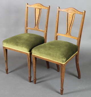 A pair of Victorian inlaid rosewood bedroom chairs with over stuffed seats, on square tapering supports, spade feet (frames loose) 