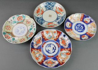 A late 19th Century Imari scalloped dish with panels of flowers and trees 9", 3 others 