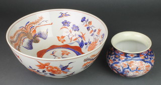 A 20th Century Imari punch bowl decorated with exotic birds and flowers 14", a late 19th Century Imari jardiniere decorated with flowers 5" 