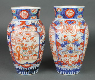 A pair of late 19th Century Imari oviform vases decorated with panels of garden views on a ground of scrolling flowers 11" 