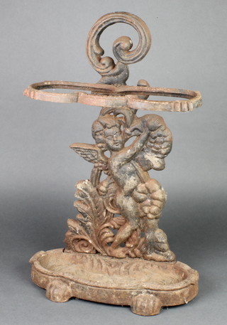 A Victorian style cast iron stick/umbrella stand decorated a figure of Bacchus with detachable drip tray 25"h x 14"w x 7"d 