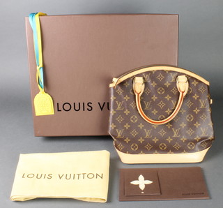 Louis Vuitton, a lady's vintage "Lockit" handbag in monogram canvas and tan leather, complete with original box, dust bag, gift card and box ribbons 11" x 11 1/2" x 4 3/4"  