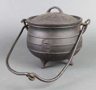 An iron cauldron complete with lid 7" x 8"