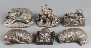 A bronzed figure of a seated vixen with cubs 6", 2 bronzed figures of reclining pugs 4 1/2", ditto of 2 seated Alsatian puppies and 2 other bronze figures 
