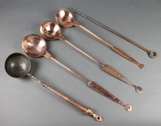 4 Persian engraved copper ladles together with a poker 
